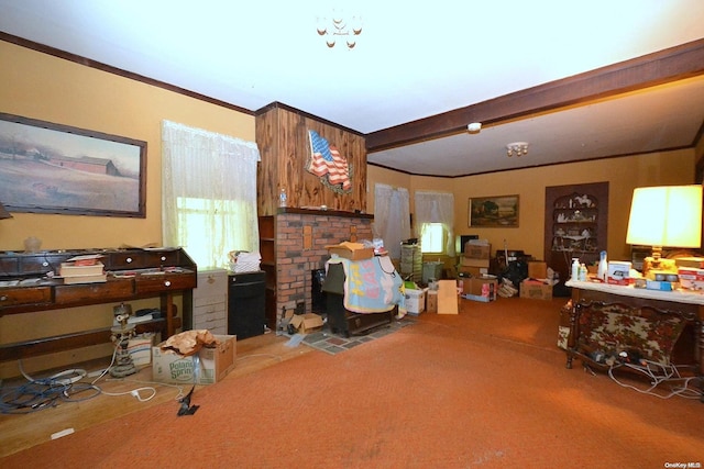 carpeted living room with crown molding and beamed ceiling