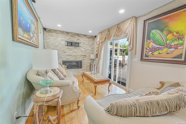 living room featuring a fireplace and hardwood / wood-style floors