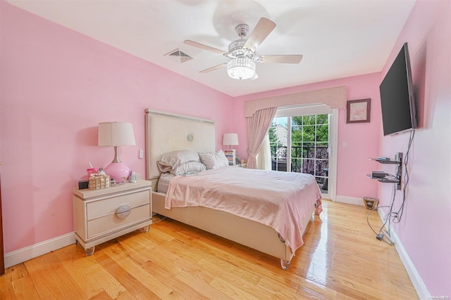 bedroom with ceiling fan, light wood-type flooring, and access to outside