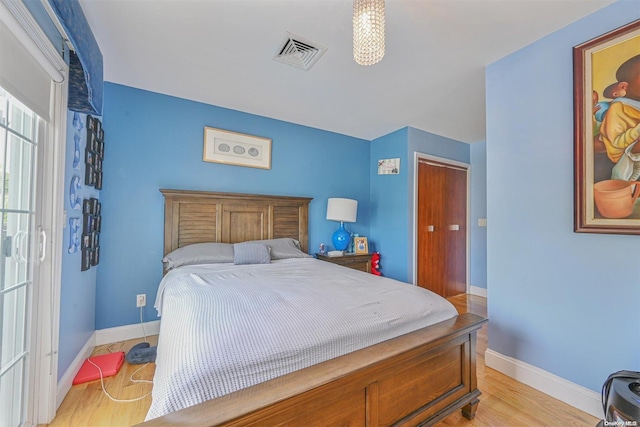 bedroom with light wood-type flooring