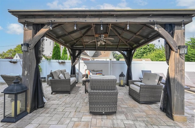 view of patio / terrace featuring a gazebo, ceiling fan, and outdoor lounge area