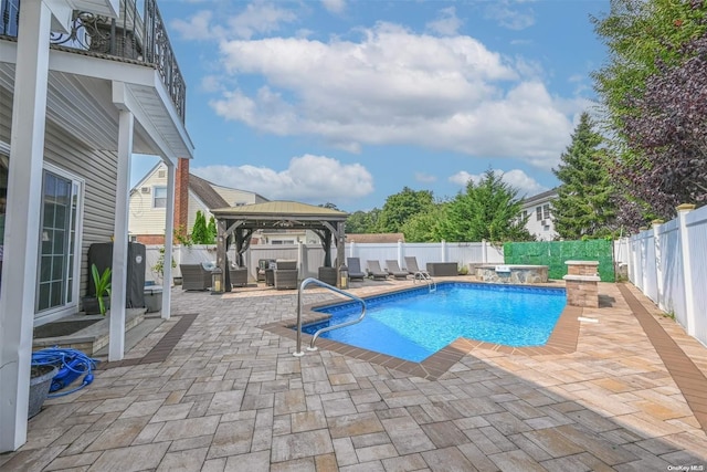 view of pool featuring a jacuzzi, a gazebo, an outdoor hangout area, and a patio area