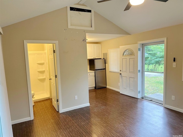 unfurnished living room featuring ceiling fan, dark wood-type flooring, and high vaulted ceiling