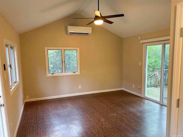 spare room featuring plenty of natural light, lofted ceiling, dark wood-type flooring, and a wall mounted AC