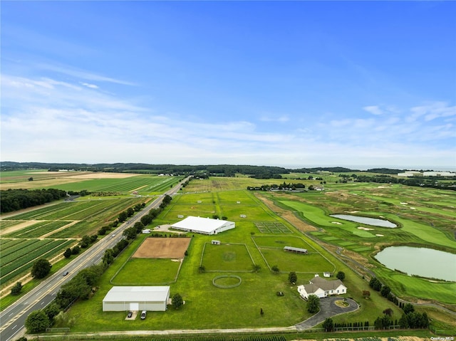 aerial view with a rural view and a water view