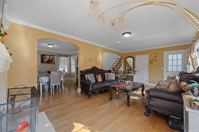 living room featuring light hardwood / wood-style flooring and ornamental molding