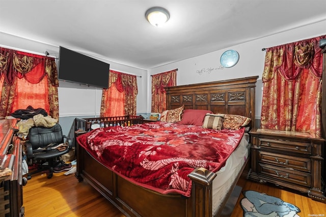 bedroom with hardwood / wood-style floors