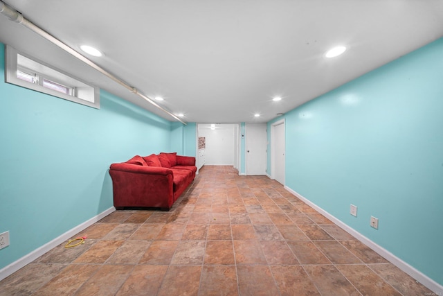 sitting room featuring baseboards and recessed lighting