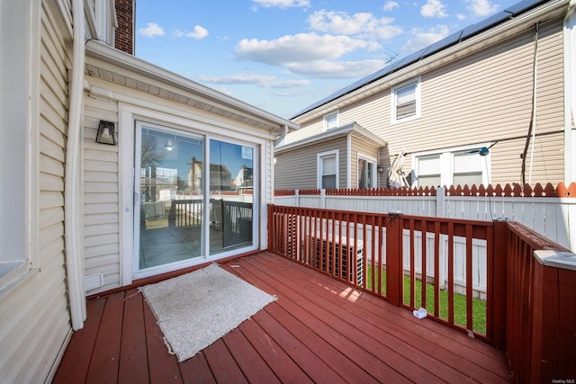 wooden terrace featuring fence