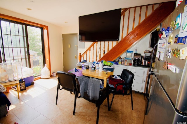 dining area featuring light tile patterned flooring