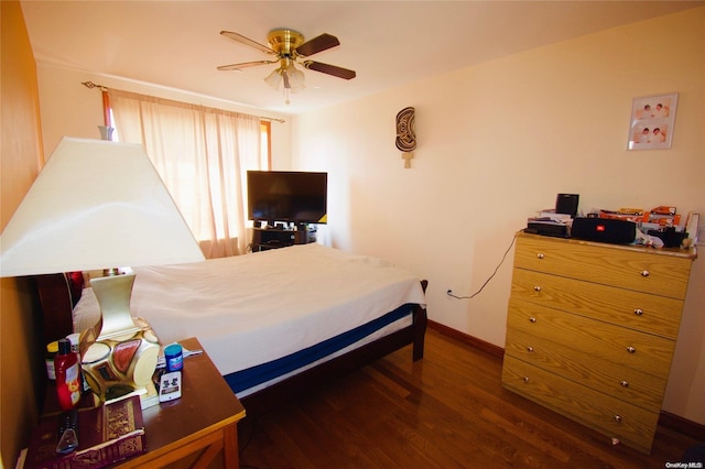 bedroom featuring ceiling fan and dark wood-type flooring