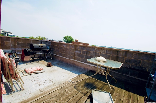 wooden deck with grilling area