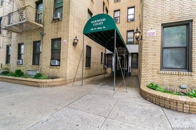 doorway to property with cooling unit