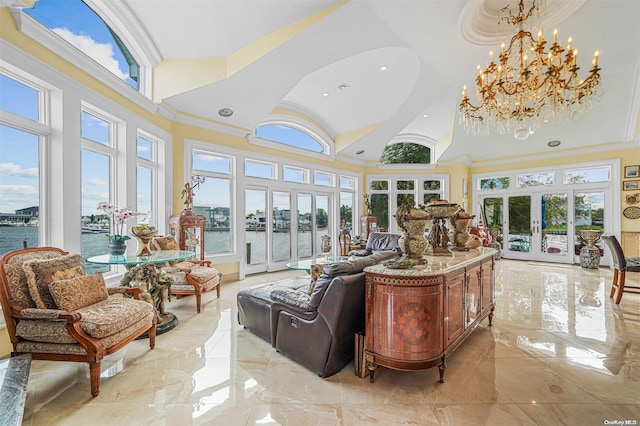 sunroom / solarium with a wealth of natural light, french doors, a water view, and a chandelier