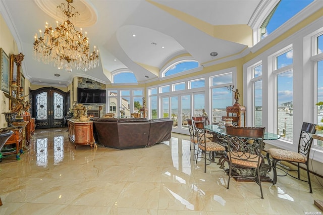 dining space featuring ornamental molding, a wealth of natural light, and french doors