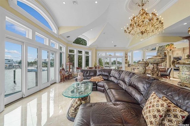 living room with a water view, ornamental molding, high vaulted ceiling, and french doors