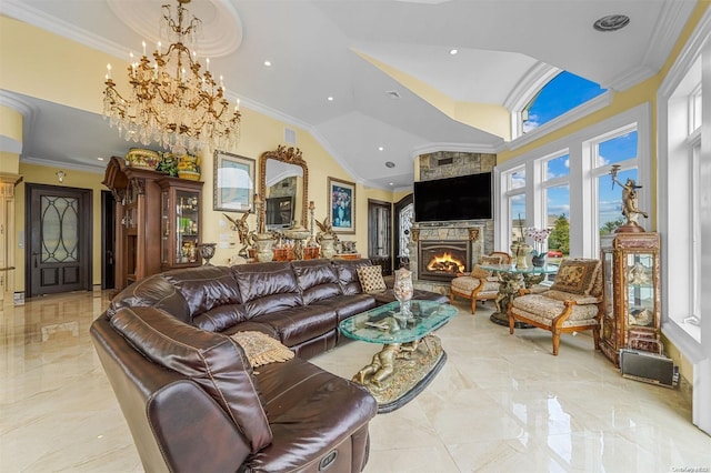 living room featuring an inviting chandelier, high vaulted ceiling, a stone fireplace, and crown molding