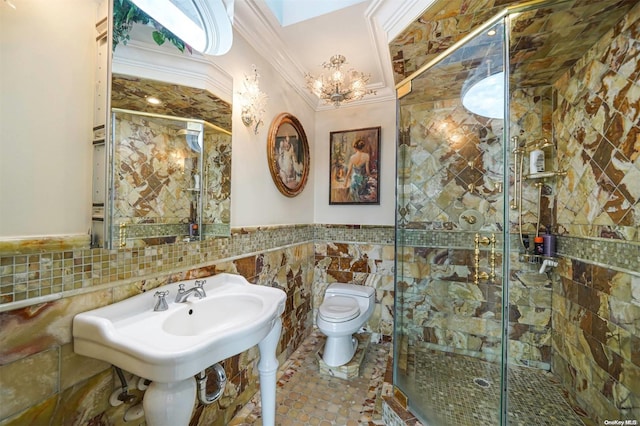 bathroom featuring sink, crown molding, toilet, tile walls, and an enclosed shower