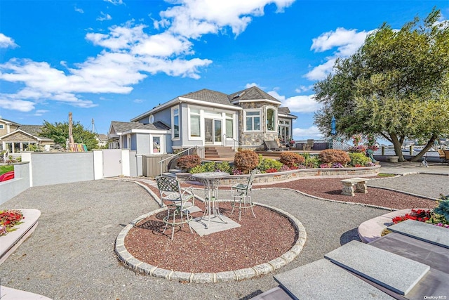 view of front of house with a patio area