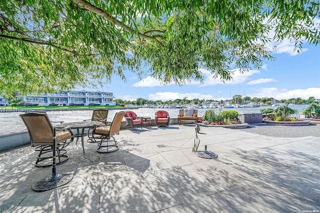 view of patio / terrace featuring a water view