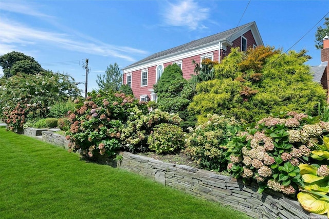 view of home's exterior featuring a lawn