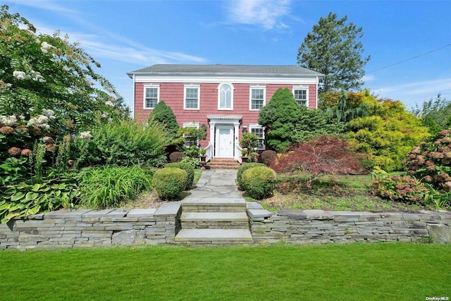 colonial house with a front lawn