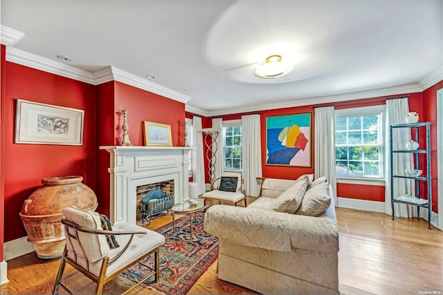 living area featuring light wood-type flooring, a wealth of natural light, and ornamental molding