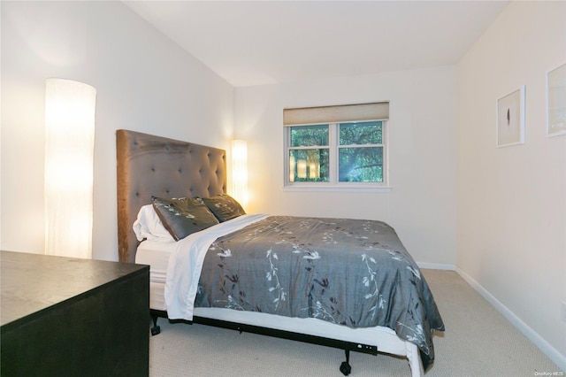 bedroom with light colored carpet