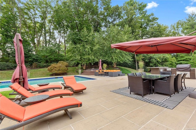 view of patio with a grill