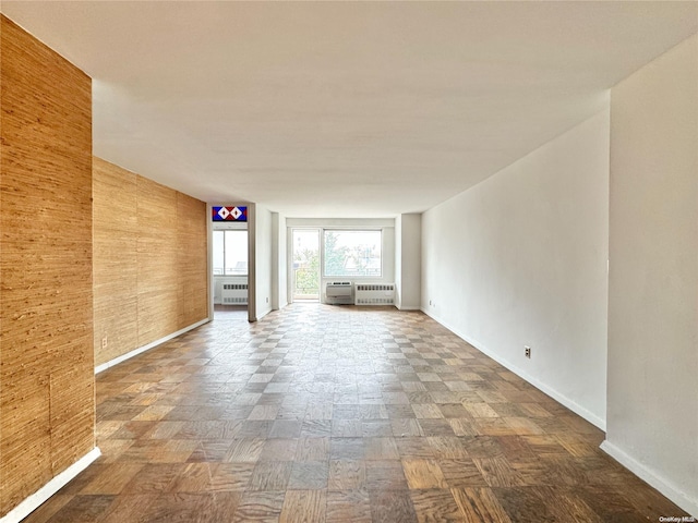 empty room featuring wooden walls