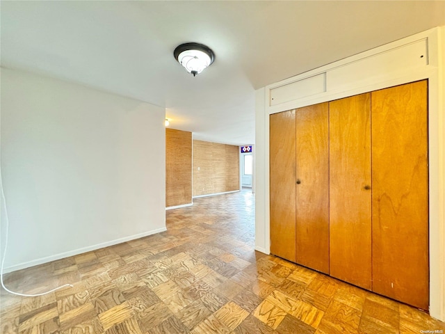 unfurnished bedroom with a closet