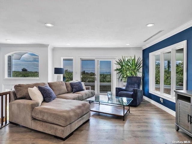 living room with ornamental molding and dark wood-type flooring