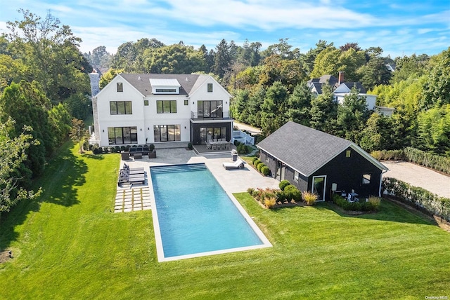 back of property featuring a yard, an outdoor hangout area, a balcony, and a patio