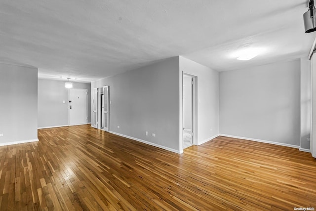 spare room featuring hardwood / wood-style flooring