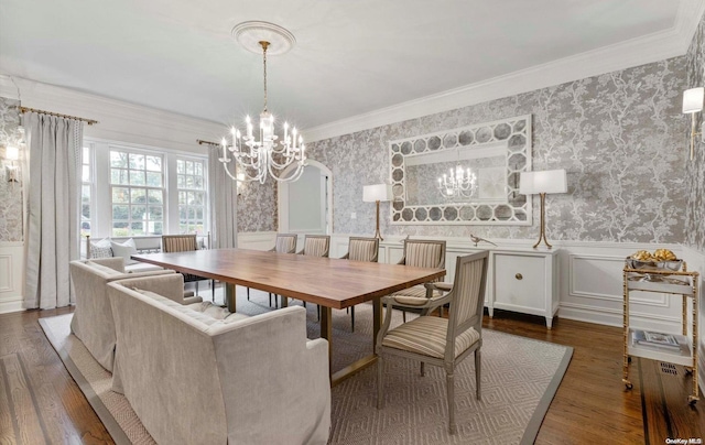 dining room featuring an inviting chandelier, dark hardwood / wood-style floors, and ornamental molding