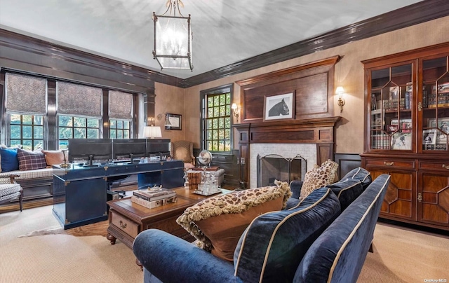 carpeted living room with a fireplace and ornamental molding