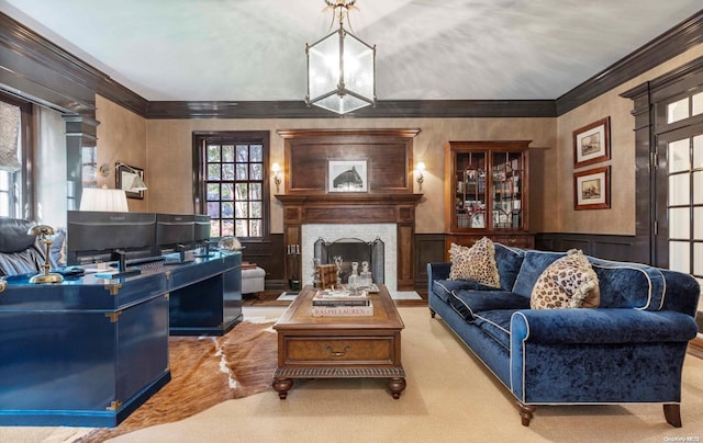 living room with a notable chandelier, light colored carpet, ornamental molding, and a fireplace