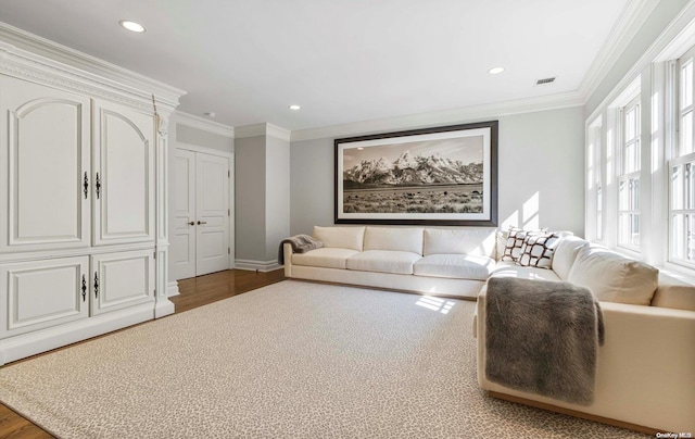 living room with dark hardwood / wood-style floors and ornamental molding