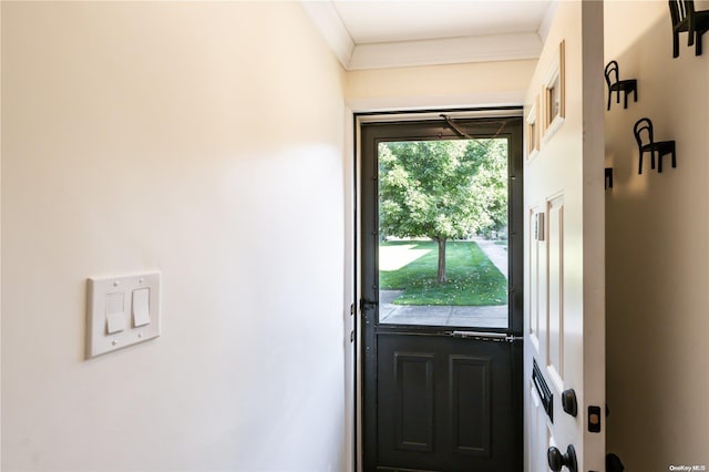 doorway featuring ornamental molding