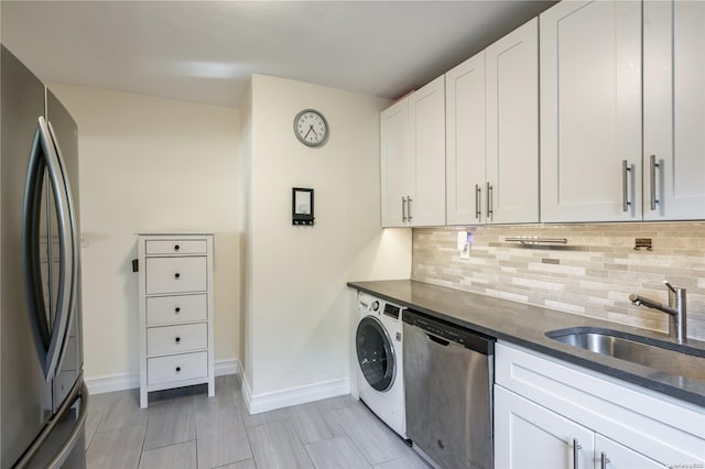 laundry area with sink and washer / clothes dryer