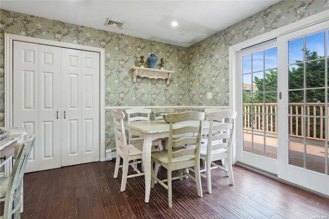 dining space with dark hardwood / wood-style floors