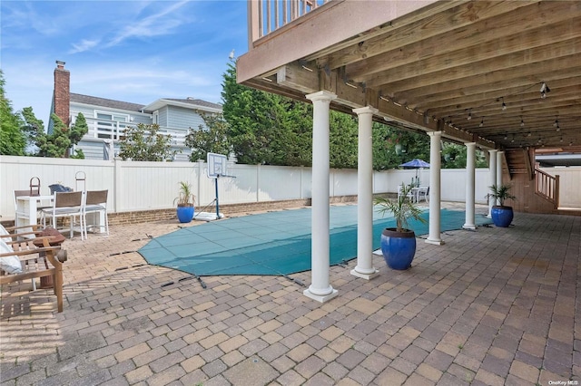 view of swimming pool with a patio area