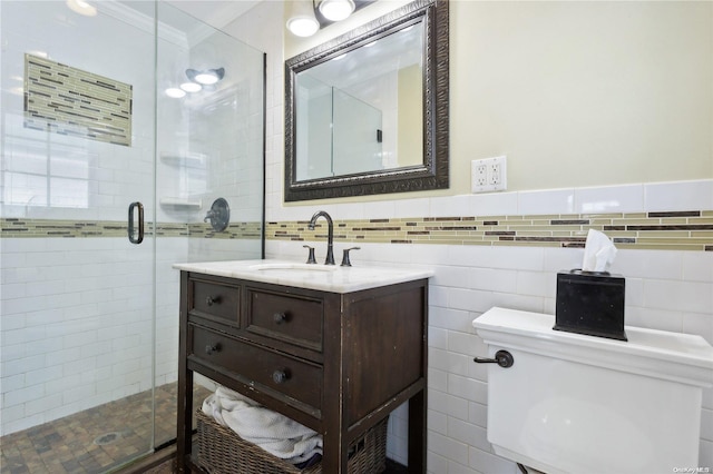 bathroom with vanity, toilet, ornamental molding, and walk in shower