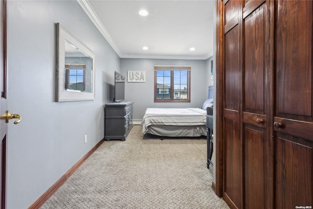 bedroom with baseboard heating and crown molding