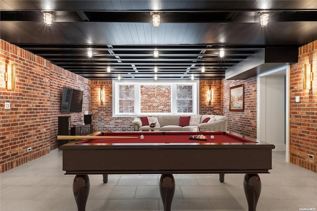 rec room with light tile patterned floors, billiards, and brick wall