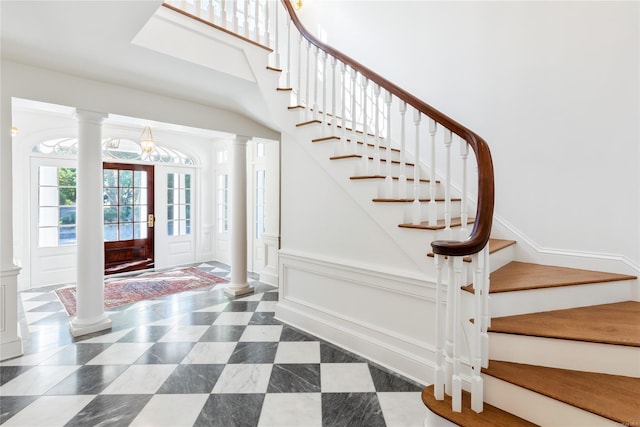 foyer featuring ornate columns