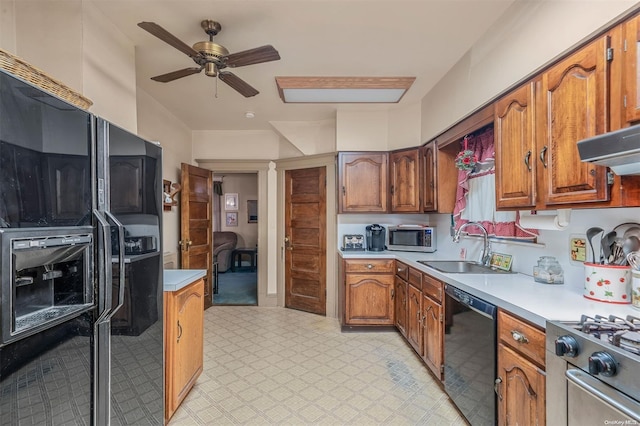 kitchen featuring sink, ventilation hood, ceiling fan, and black appliances