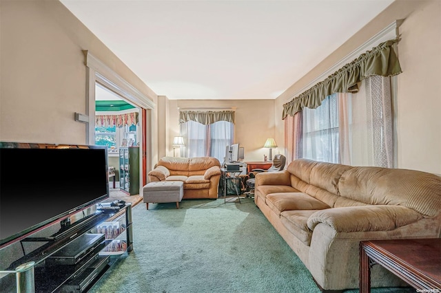 living room featuring carpet and plenty of natural light