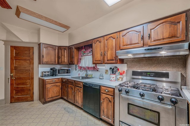 kitchen with appliances with stainless steel finishes, tasteful backsplash, and sink