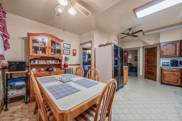 dining room featuring ceiling fan